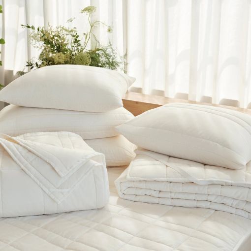 Washable Wool Filled Mattress Pad by Coyuchi
